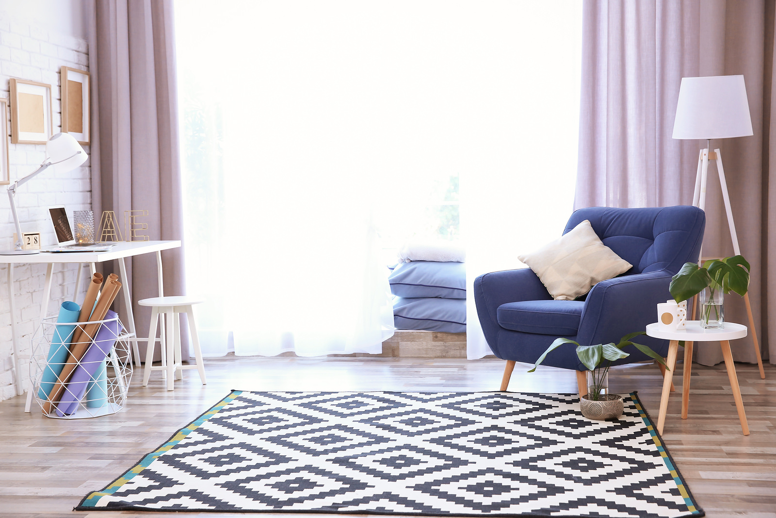 Modern living room interior with stylish armchair and carpet